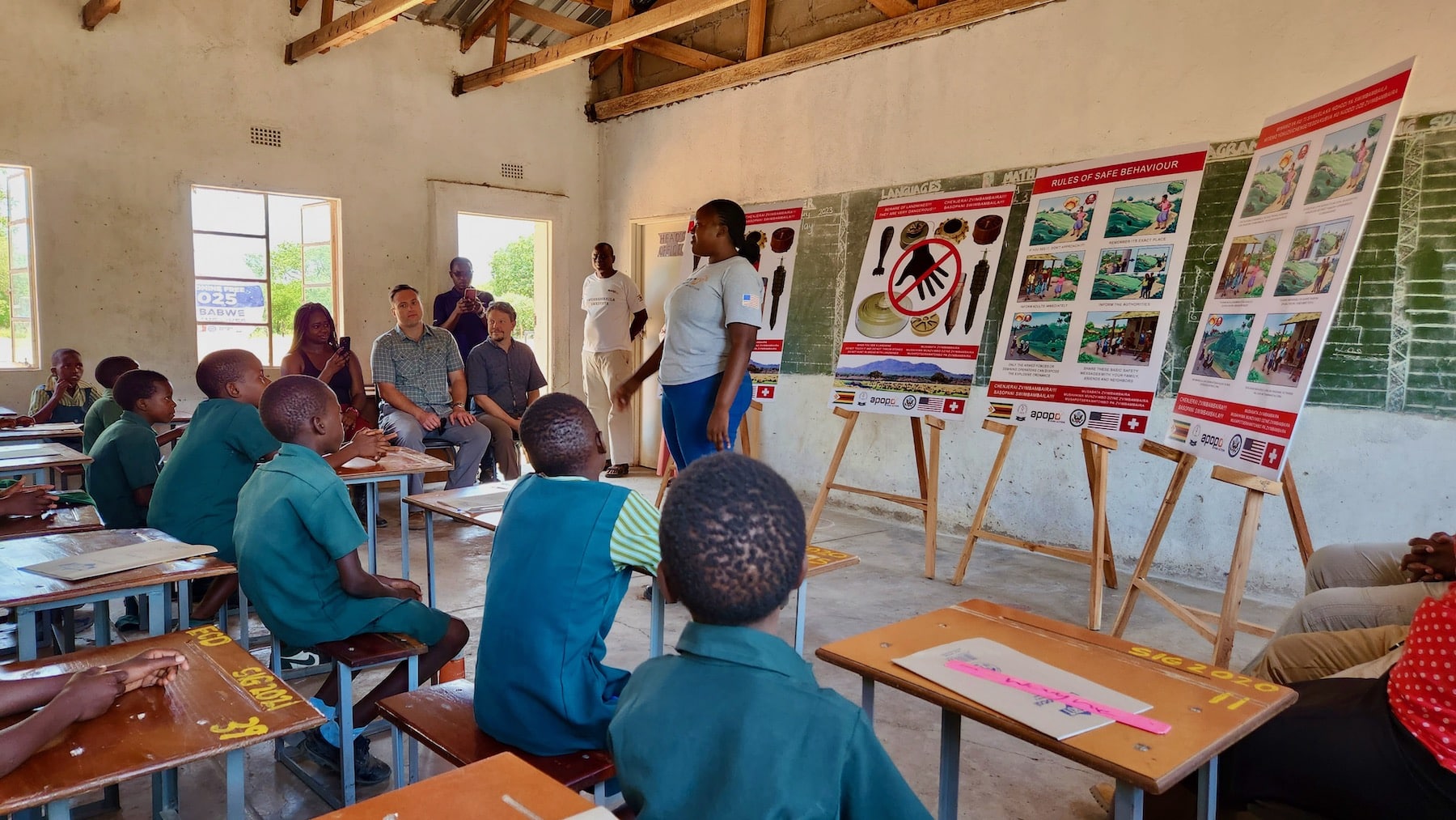 PM WRA and representatives from the US Embassy Harare attending an APOPO EORE session in Chilotlela school, adjacent to the border minefield.