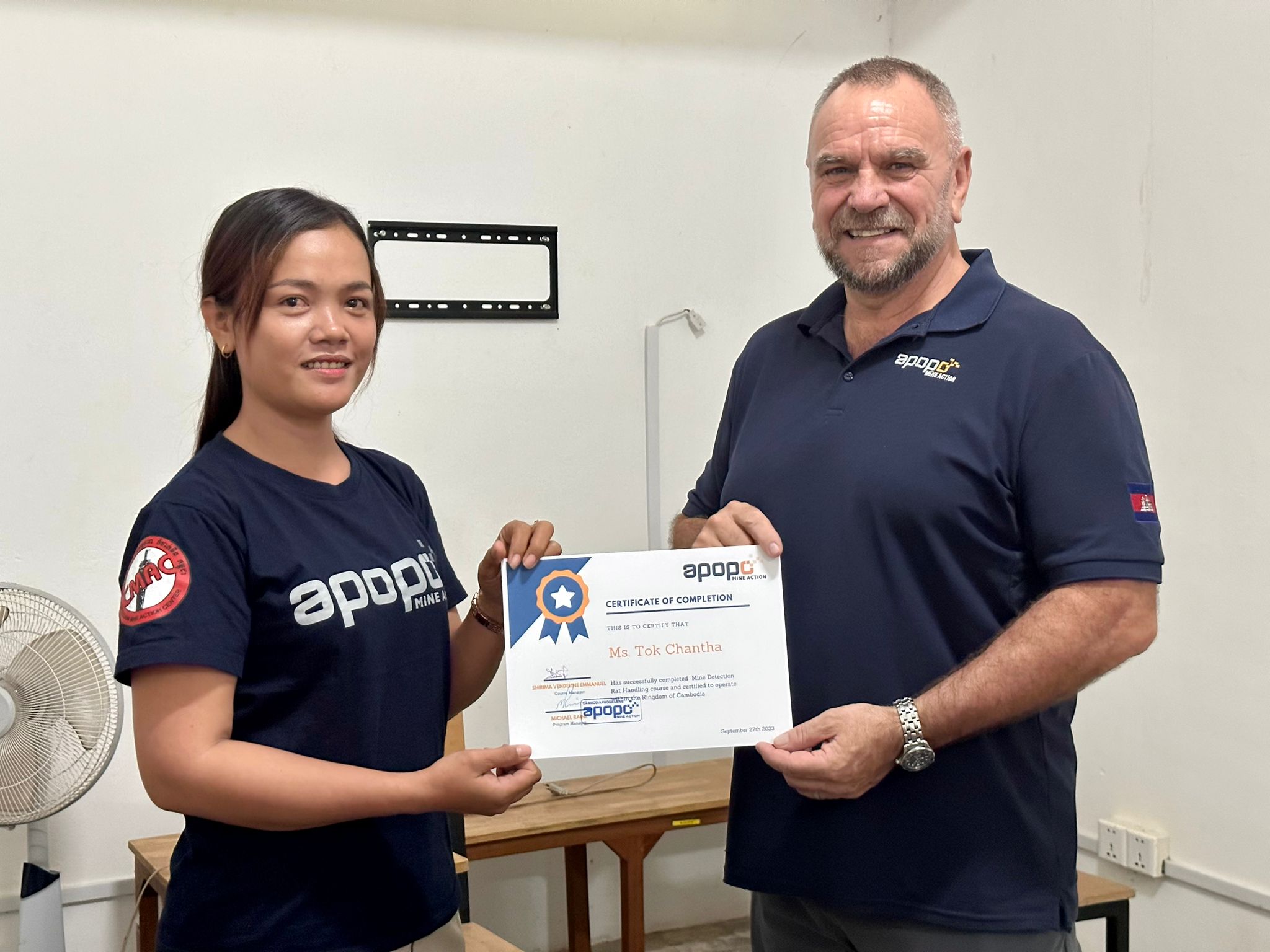 APOPO female rat handler Ms Tok Chantha receives her certificate of training
