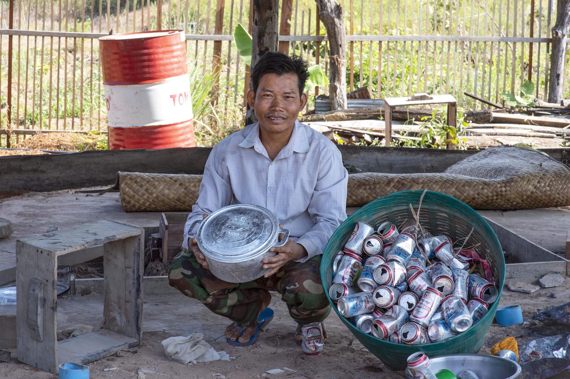 Sarun collects cans so they can be recycled into cooking pots