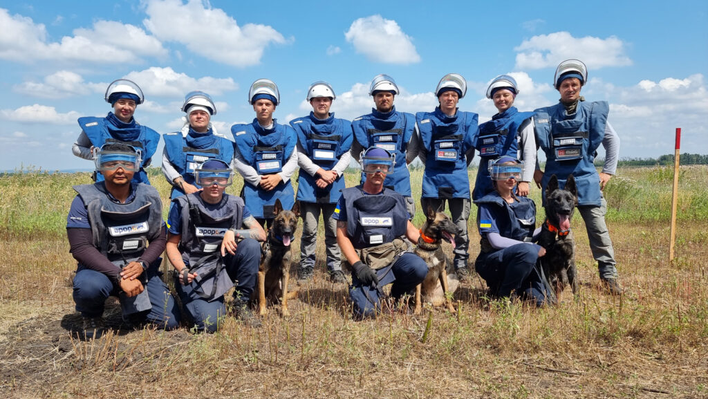 APOPO Technical Survey Dog Team in Ukraine working in collaboration with MAG deminers.
