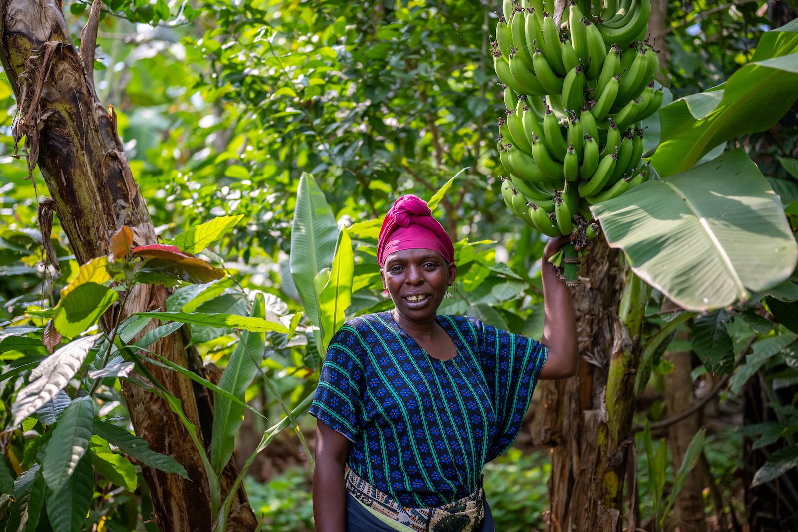 APOPO HeroTREEs farmer Devota next to Food Forest farm