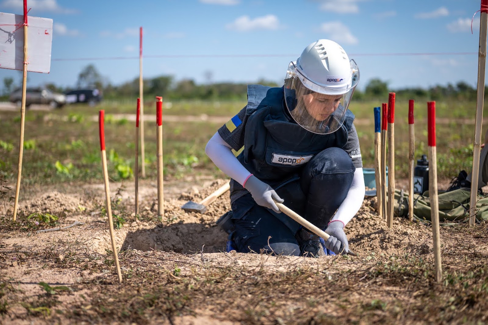 APOP manual deminer excavates a hidden landmine that will be destroyed.